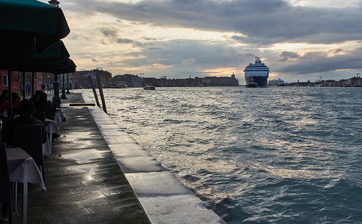 Cruise liner entering the Guidecca Canal in Venetian lagoon in spring. Venice - 4 May, 2019
