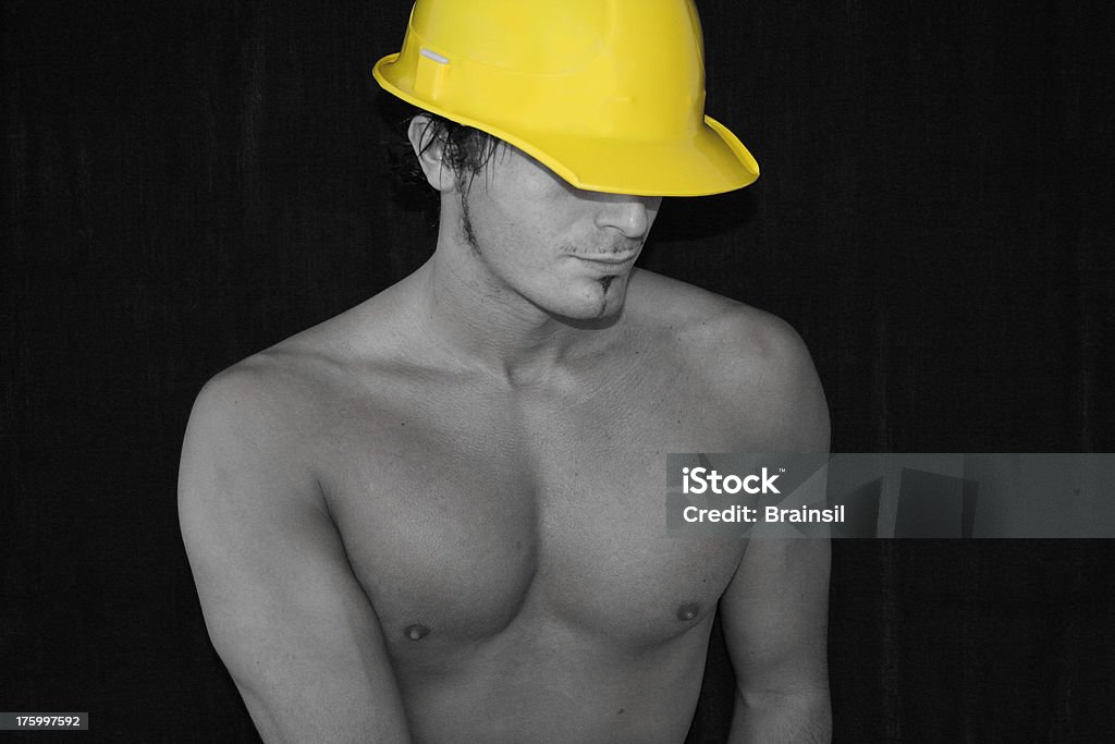 Construction Worker Construction worker wearing a hardhat 20-29 Years Stock Photo