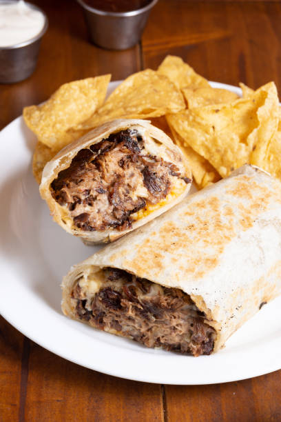 istock mexican beef burritos with cheese nachos 1759983783