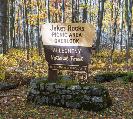 Warren, Pennsylvania, USA October 23, 2023 The Jakes Rocks Picnic Area Overlook sign in the Allegheny National Forest on a sunny fall day
