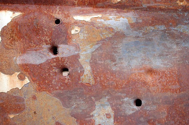 fori di proiettile in arrugginito auto a pannello - vehicle door rusty old fashioned old foto e immagini stock