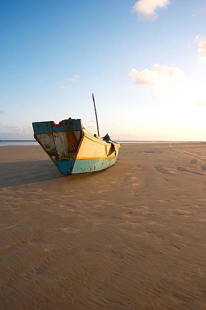 istock Canoe rests in the sand at sunset  (Brazil) 175999503