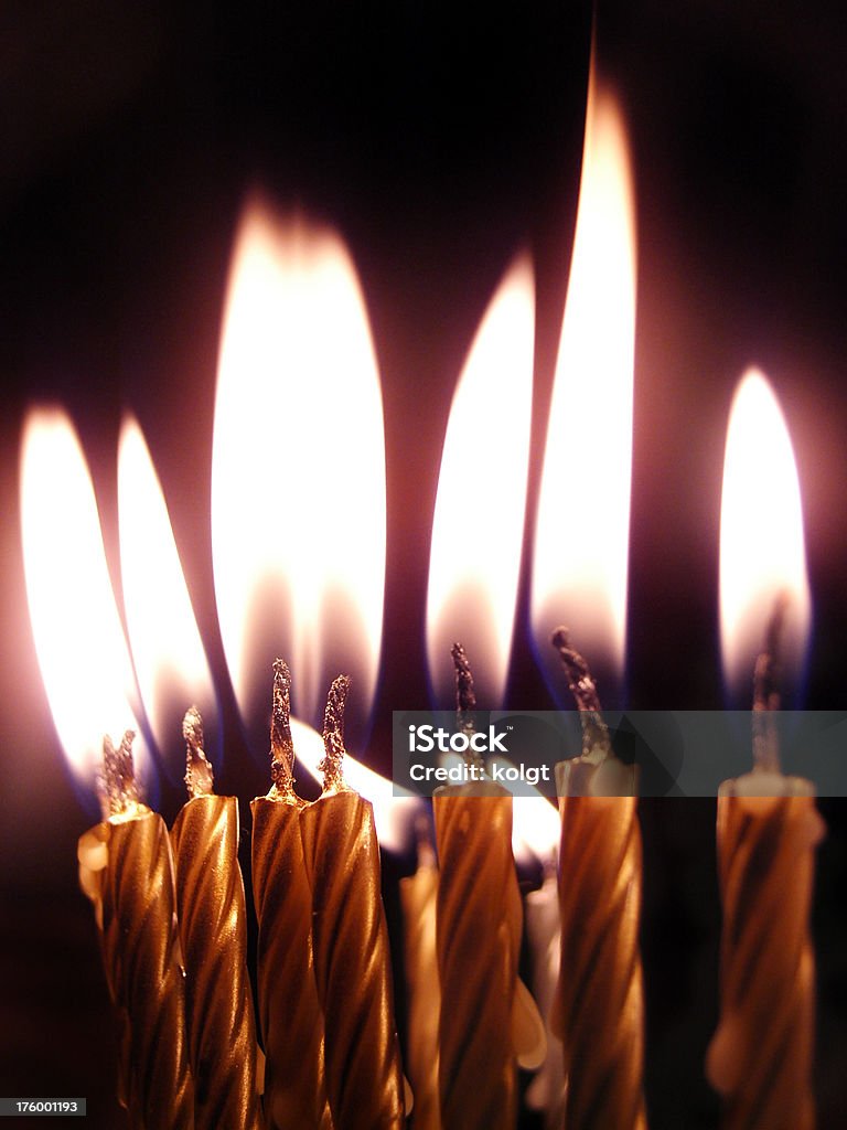 Big Candle Flames Candles on a birthday cake.  See also Aging Process Stock Photo