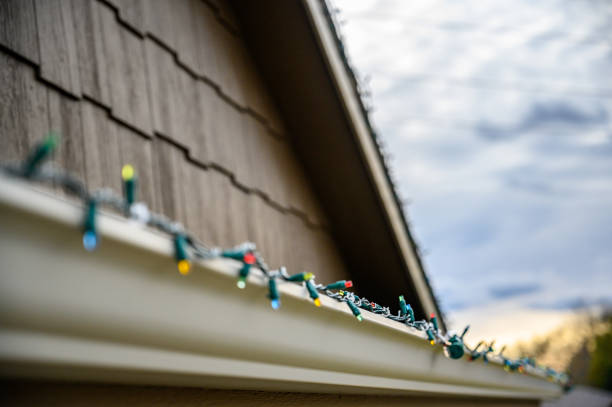 istock Hanging Christmas lights on gutter with plastic clips 1760015858