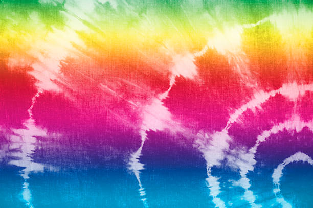 Rainbow Tie Dye Fabric Tie dye fabric in rainbow colors. Self-made print on the fabric. spiral rock stock pictures, royalty-free photos & images