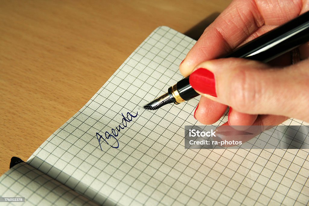 Writing on notepad Fountain pen writing on notepad Adult Stock Photo