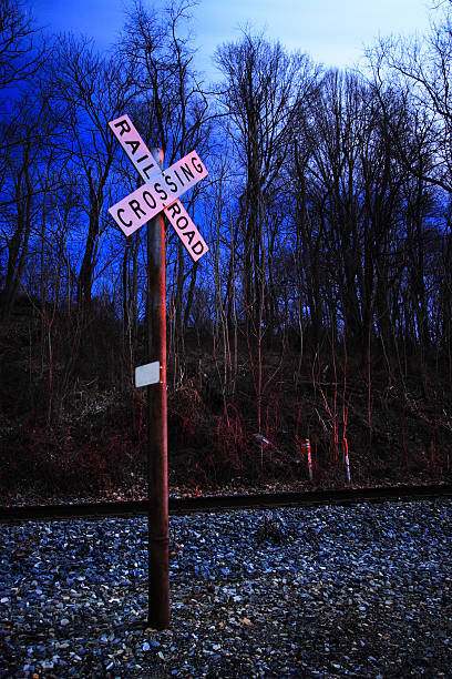 Railroad Crossing at night stock photo