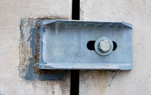istock metal bracket and bolt on cement 176003265