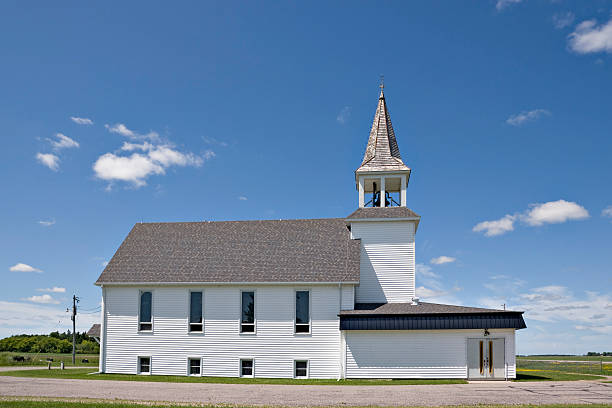 istock white church with open bell tower in rural area 176004031