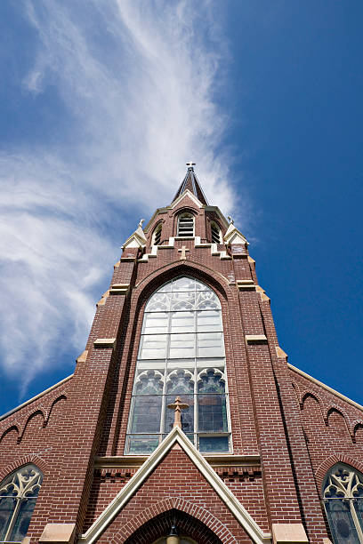 istock church steeple and wispy clouds 176004369