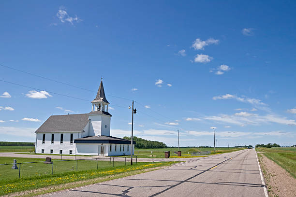 istock white country church and road 176004504