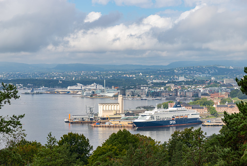 Oslo, Norway - August 12, 2023: A picture of Oslo and the Inner Oslofjord, with a DFDS cruise at the Oslo Port.