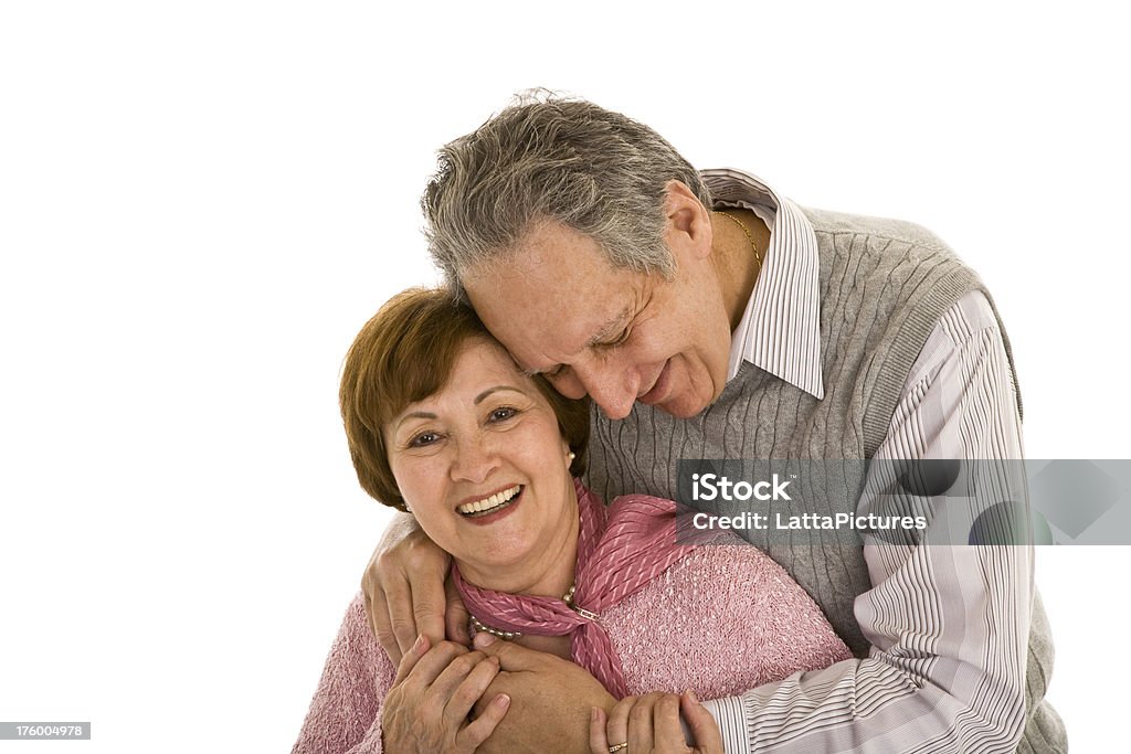 Senior couple embracing and smiling "Happy senior couple in love, isolated on white background" 60-69 Years Stock Photo