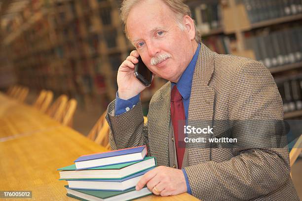 Professor In The Library Stock Photo - Download Image Now - Librarian, 50-54 Years, Active Seniors