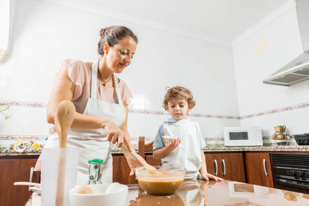 istock A woman and a child cooking. 1760051604