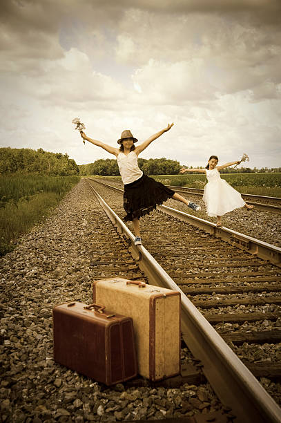 istock Old fashioned kids on a railroad 176005345