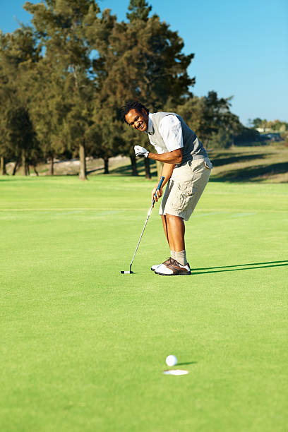 istock African American man playing a game of golf 176005655
