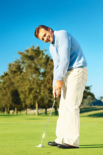 istock Happy mature golfer during a game of golf 176005786