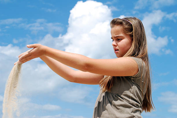 istock young girl at the beach 176005802