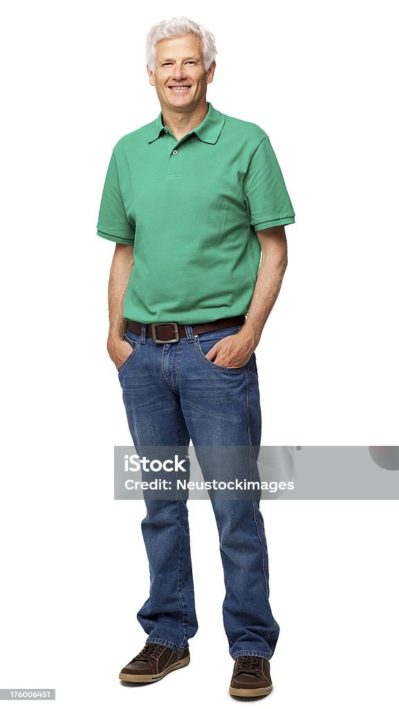 Senior Man Standing With Hands In Pockets - Isolated Full length portrait of senior man in casual wear standing with hands in pockets. Vertical shot. Isolated on white. Men Stock Photo