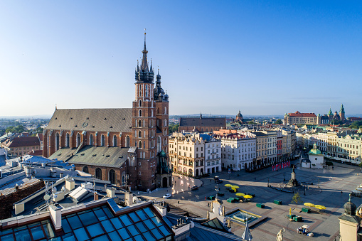 Krakow, Poland. Aerial view of old town, with Main Market Square (Rynek),  St. Mary Gothic church (Mariacki), Mickiewicz statue, St. Adalbert small church and far view of Wawel castle and cathedral