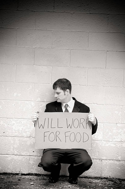 istock Unemployed Businessman Will Work For Food 176006900