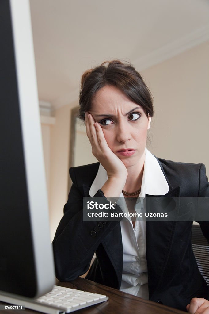 Young woman upset in front of computer display 20-29 Years Stock Photo