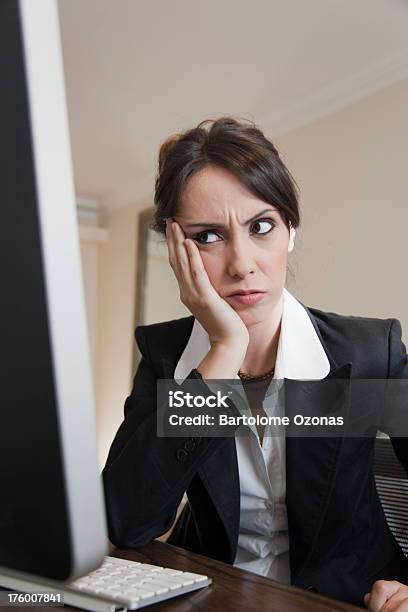 Young Woman Upset In Front Of Computer Display Stock Photo - Download Image Now - 20-29 Years, 2000-2009, 21st Century