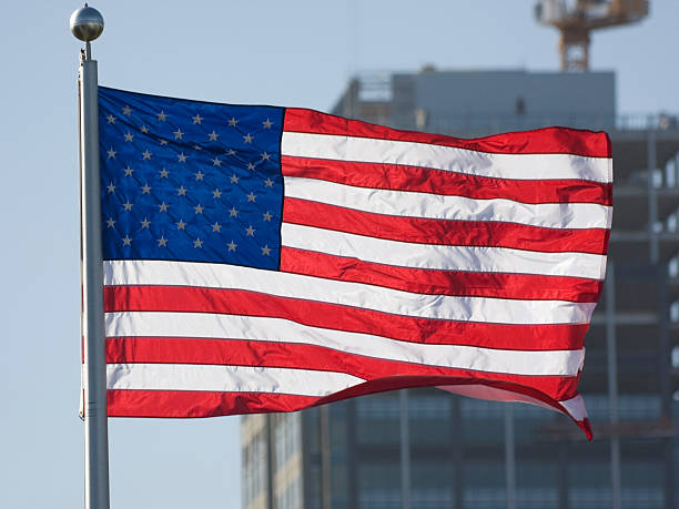 istock American Flag in front of skyscraper 176007955