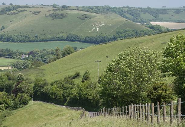 Dorset Countryside and cerne abbas giant Dorset Countryside and cerne abbas giant on a hazy summers day cerne abbas giant stock pictures, royalty-free photos & images