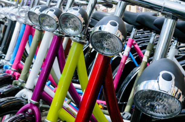 Row of multicoloured bicycles for hire in Amsterdam
