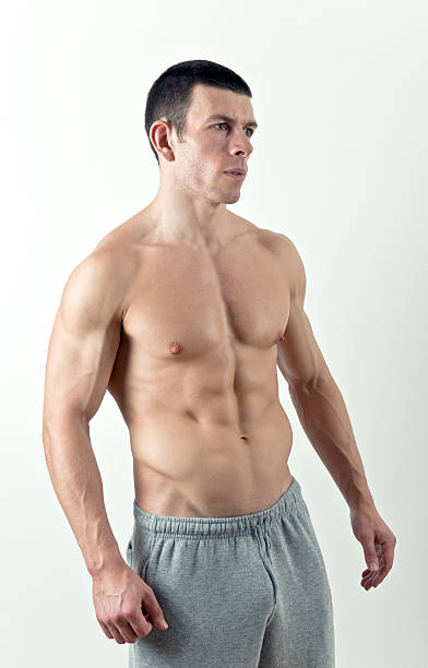 istock Shirtless muscular male looking to the side. 176008845