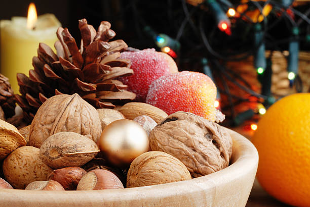 natural walnuts in a bowl on orange color background ,