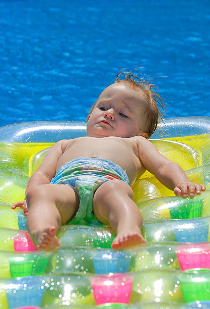 istock Baby girl at pool 176009190