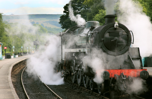 A steam locomotive gathers steam at Grosmont Station on the North York Moors Railway.More steam trains in my portfolio:
