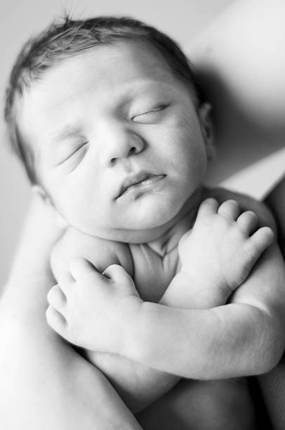 istock Newborn Baby Boy in Mama's Arms 176010098