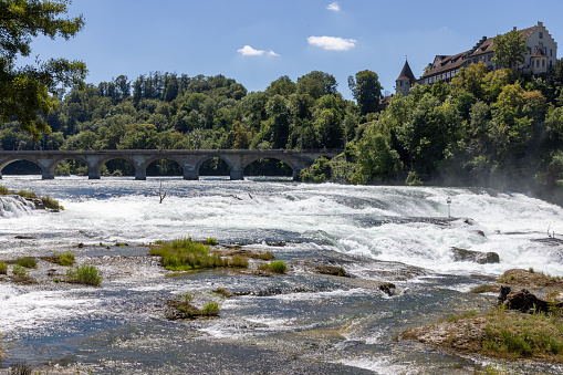 Schaffhausen Waterfalls, panoramic view with waterfalls and bridge in summer, Switzerland