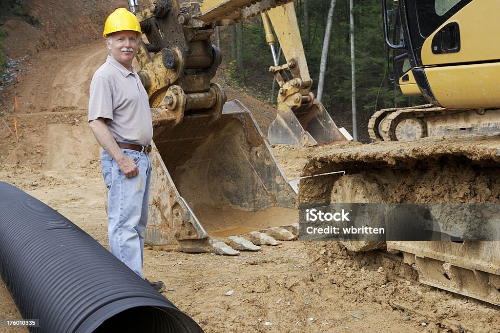 Homme avec Backhoe (XXL - Photo de Creuser libre de droits