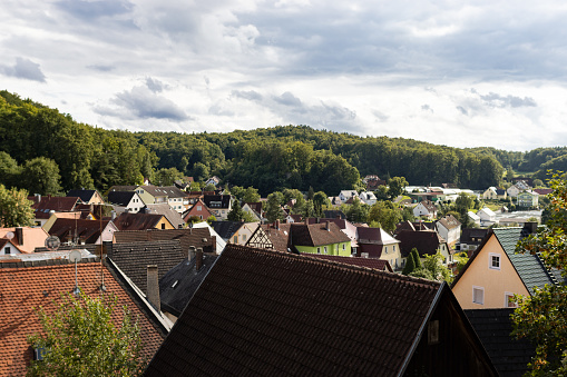 Looking over the rooftops of the houses in Gößweinstein, Germany. Landscape with the small town in Franconia. The traditional architecture is a travel destination.