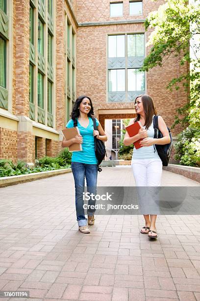 Female Students Walking On Campus Stock Photo - Download Image Now - University Student, Walking, Building Exterior