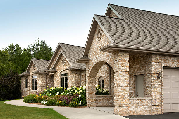 istock Charming Brick Home With Flower Garden 176011422