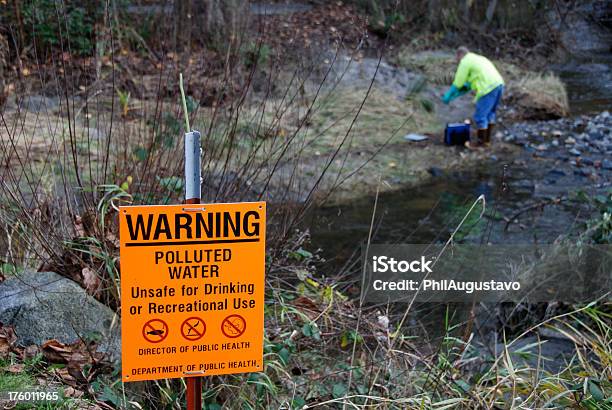Scientist Measuring Pollutants In Stream Stock Photo - Download Image Now - Adult, Adults Only, Boot