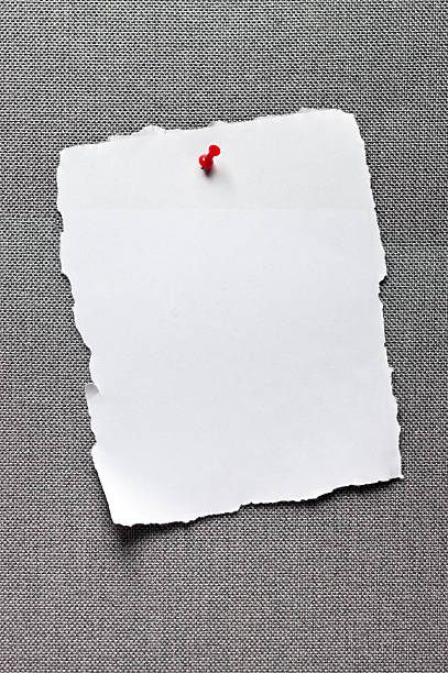 Message board with empty sheet of ripped paper