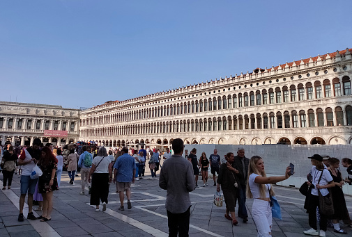 Venice, Italy - October 5, 2023: The people going near National Archaeological Museum is a museum in Venice. The building that encloses the far end of the Piazza San Marco is known as the Napoleonic Wing.