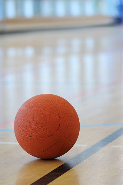 istock Basketball on the floor in a gym 176012532