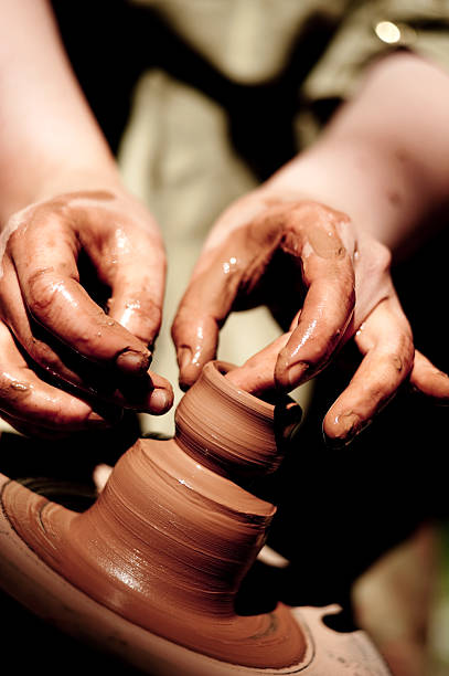 istock potter makes a jug out of clay 176012638