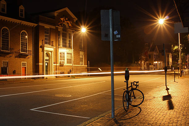 Night foggy city walk in a park with street lights. Abstract depression and anxiety concept.