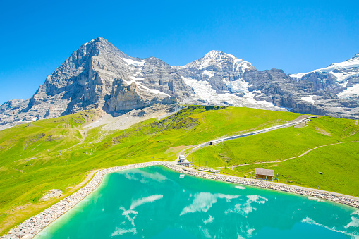 Swiss Alps and beautiful Fallboden lake near Kleine Scheidegg village, Jungfrau region, Switzerland travel photo