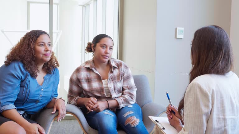 Mom and daughter listening to counselor's advice