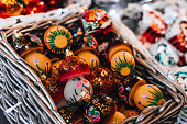 Christmas market with colorful holiday Christmas toys and souvenirs in the wicked basket